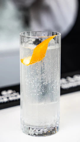 Axia Greek Mastiha Spirit and London Essence Lemonade Collins Cocktail on a bar