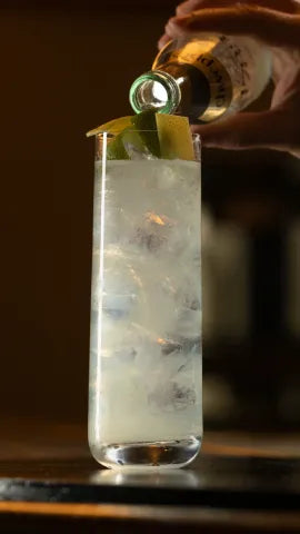 Axia Mastiha Greek Spirit and Oriole London Axia Lemonade Cocktail being made on a bar