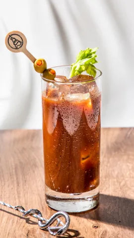 Axia Bloody Medusa Cocktail on a wooden table