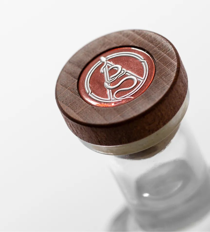 Close-up of the top bottle of Axia Mastiha Spirit on a plain light grey background