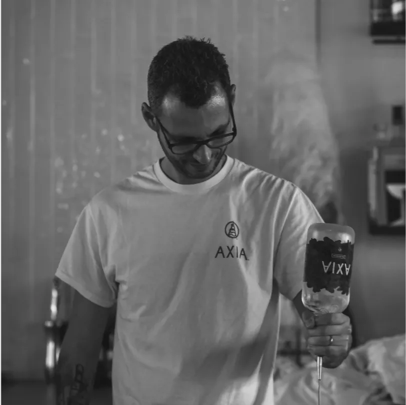 Black and white portrait of Timos Spanis, Sales and Marketing Manager of Axia Spirit